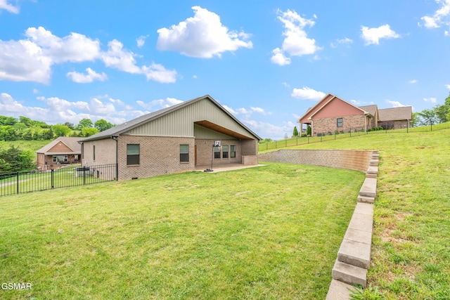 back of house with brick siding and a patio area