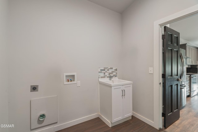 laundry room with electric dryer hookup, hookup for a washing machine, dark wood finished floors, and baseboards