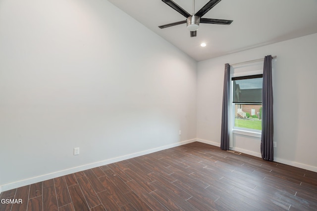 unfurnished room with dark wood-type flooring, a ceiling fan, baseboards, vaulted ceiling, and recessed lighting