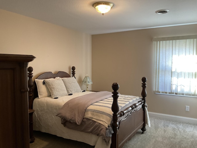 bedroom featuring light colored carpet