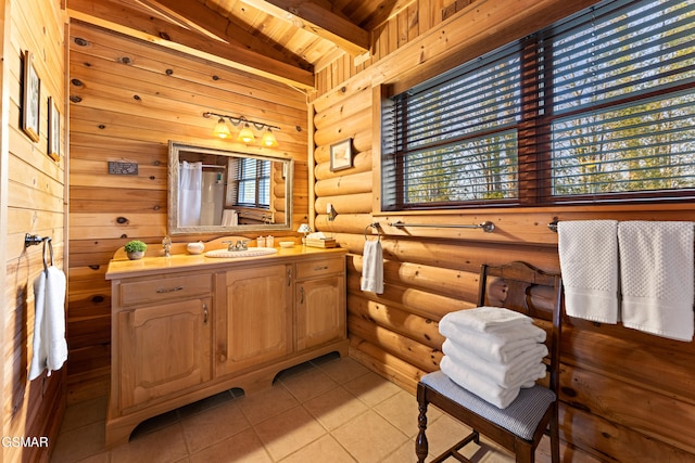 bathroom featuring beam ceiling, wooden ceiling, tile patterned flooring, log walls, and vanity