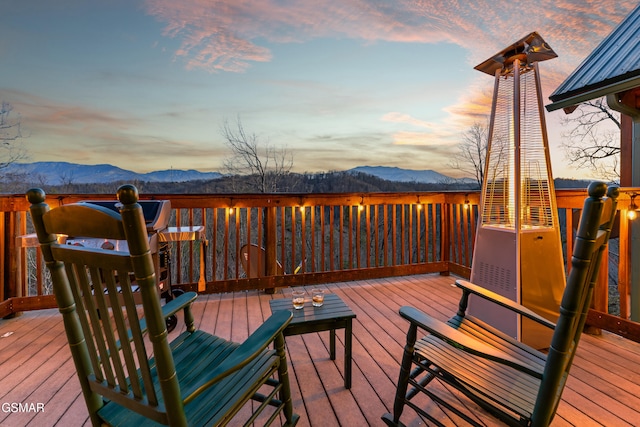 wooden terrace with a mountain view