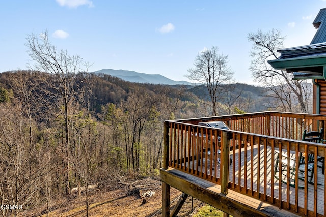 exterior space with a mountain view and a wooded view