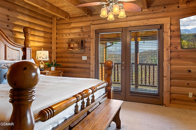 carpeted bedroom featuring rustic walls, beam ceiling, wood ceiling, and access to exterior