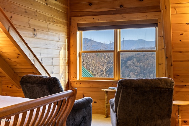 interior space featuring a mountain view and wood walls