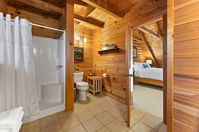 full bath featuring tile patterned flooring, curtained shower, toilet, and beamed ceiling