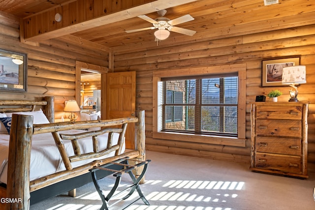 carpeted bedroom with wood ceiling and rustic walls