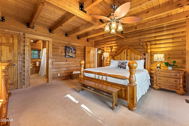 carpeted bedroom with beam ceiling, ensuite bathroom, and wooden ceiling