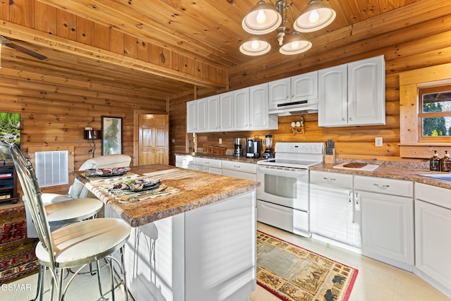 kitchen with under cabinet range hood, visible vents, white electric stove, and white cabinetry