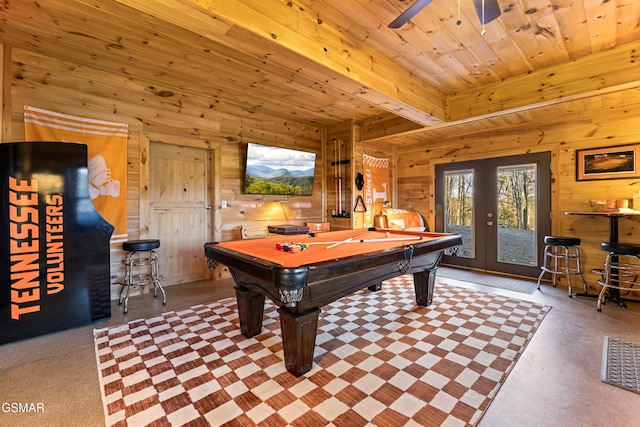 game room with wood ceiling, french doors, beamed ceiling, and wood walls