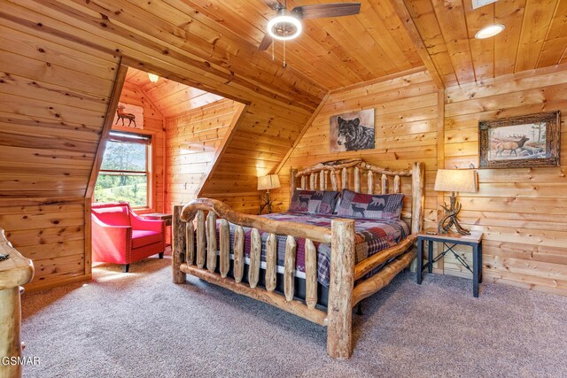 bedroom featuring carpet flooring, wooden walls, and wooden ceiling