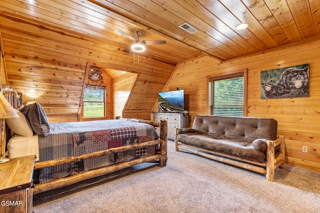 bedroom featuring ceiling fan, wood ceiling, carpet floors, and wooden walls