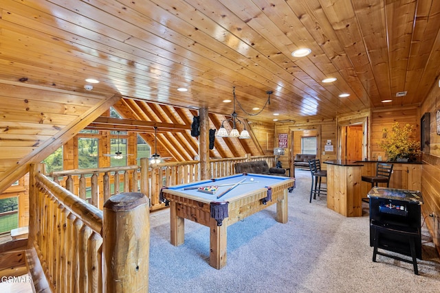 recreation room with lofted ceiling, wooden ceiling, light carpet, wooden walls, and billiards