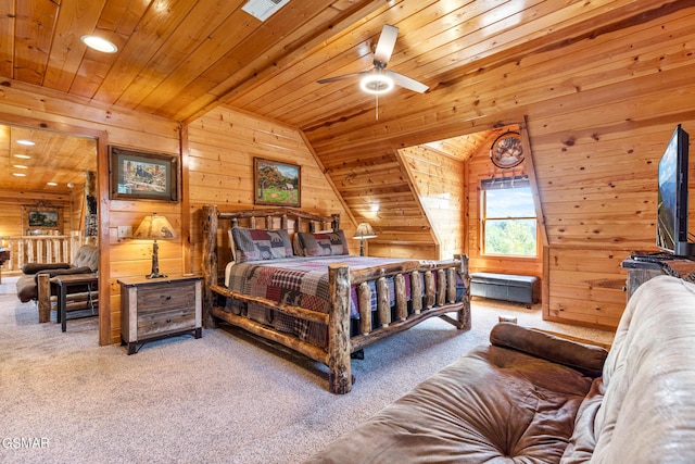 bedroom featuring carpet, wood ceiling, and wooden walls