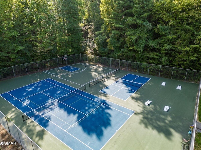 view of sport court with community basketball court and fence