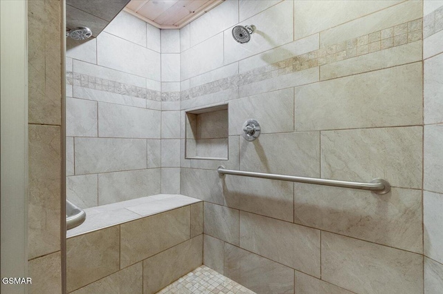 full bath featuring tiled shower