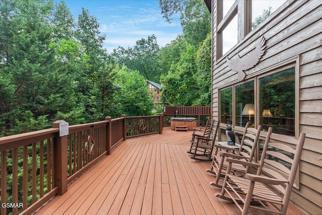 deck with a hot tub