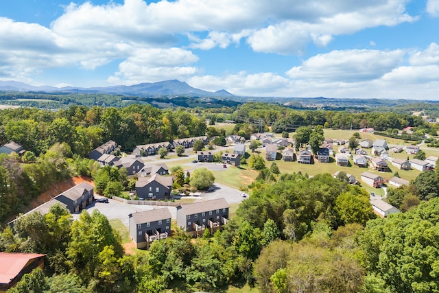 aerial view featuring a forest view, a mountain view, and a residential view