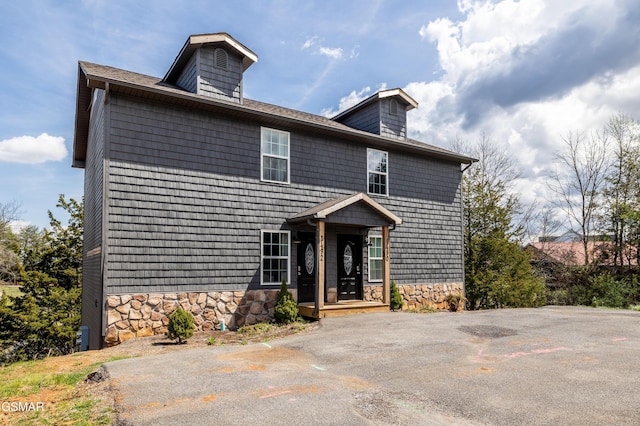 view of front of house with stone siding