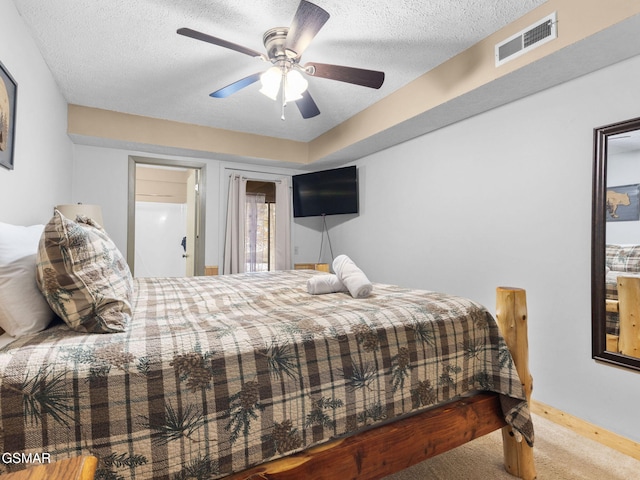 1663 S Mountain View Rd, Sevierville, TN 37876 - carpeted bedroom featuring ceiling fan and a textured ceiling