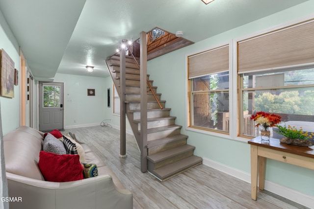 stairway featuring wood-type flooring