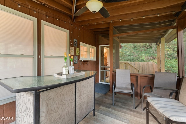 sunroom / solarium with ceiling fan