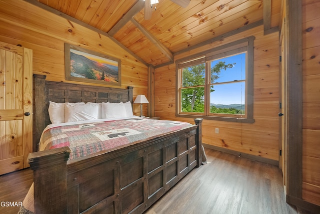 bedroom with wood walls, wood finished floors, wood ceiling, and vaulted ceiling