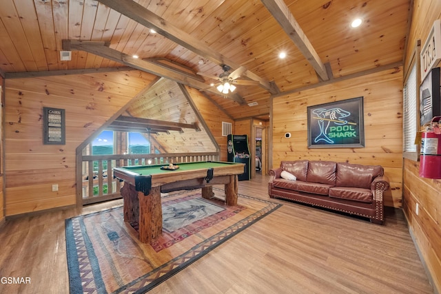 recreation room with wood walls, wood ceiling, vaulted ceiling with beams, and wood finished floors