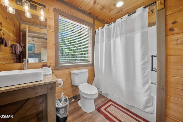 bathroom with shower / tub combo with curtain, wood walls, toilet, and wood finished floors