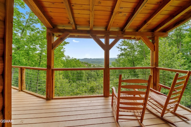 wooden terrace featuring a mountain view