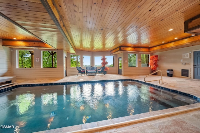 pool with a patio area and outdoor dining area