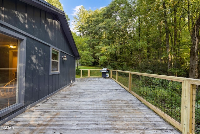 wooden terrace featuring grilling area