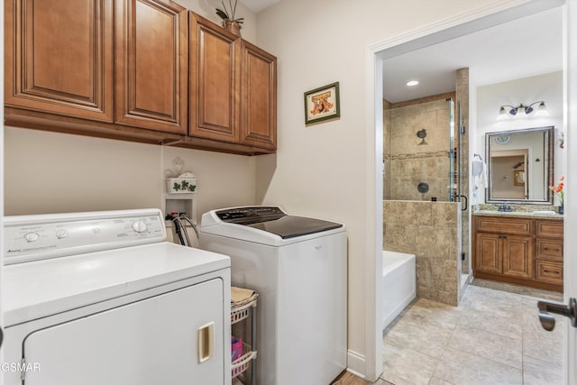 2159 Frewin Ct, Sevierville, TN 37876 - washroom with separate washer and dryer, cabinet space, and light tile patterned floors