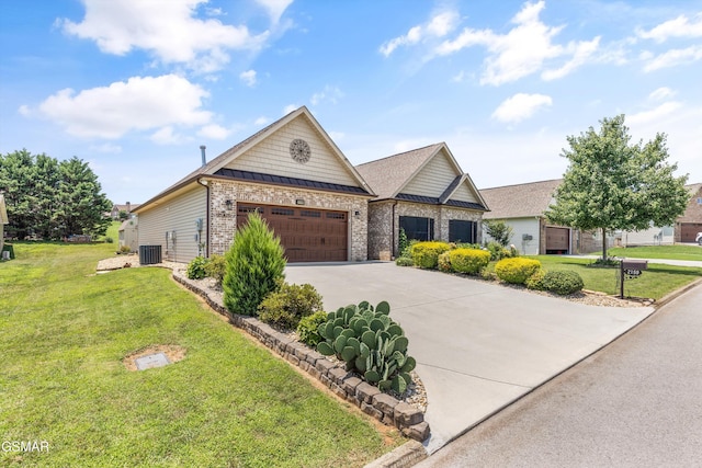 2159 Frewin Ct, Sevierville, TN 37876 - view of front of property with an attached garage, driveway, a front lawn, and brick siding
