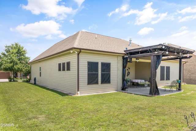 2159 Frewin Ct, Sevierville, TN 37876 - back of property featuring roof with shingles, a patio, and a yard