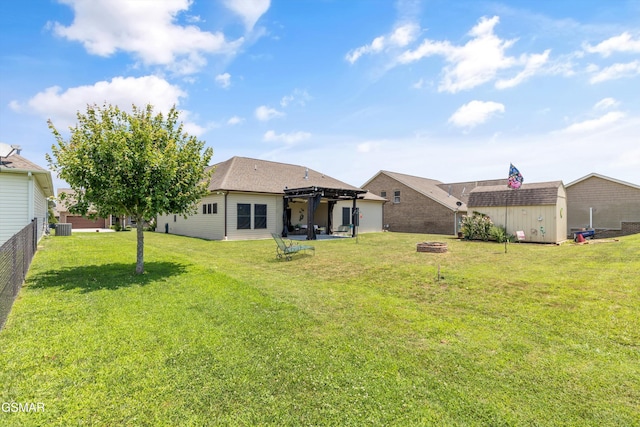 2159 Frewin Ct, Sevierville, TN 37876 - back of house featuring a pergola, an outdoor fire pit, and a shed