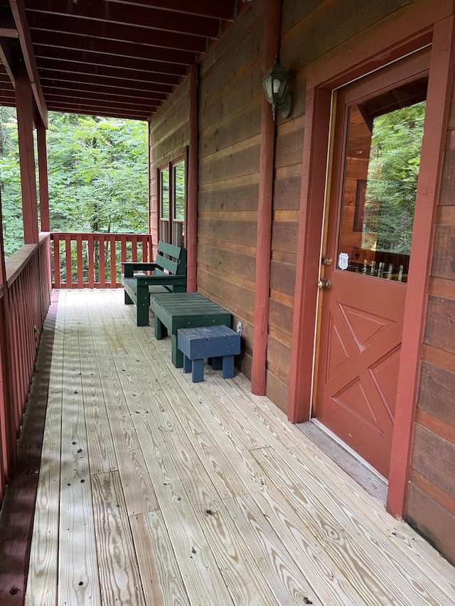 wooden terrace featuring a porch