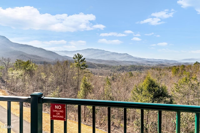 view of mountain feature with a view of trees