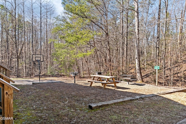 view of yard featuring a wooded view