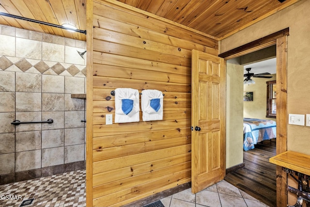 full bathroom with ceiling fan, tile patterned flooring, wood ceiling, a shower, and ensuite bath