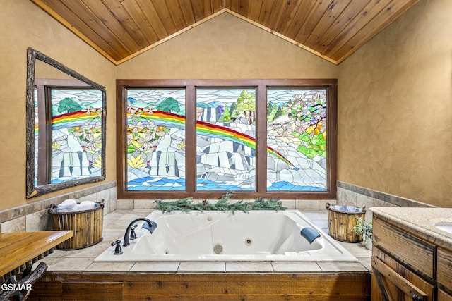 bathroom with vaulted ceiling, a tub with jets, vanity, and wood ceiling