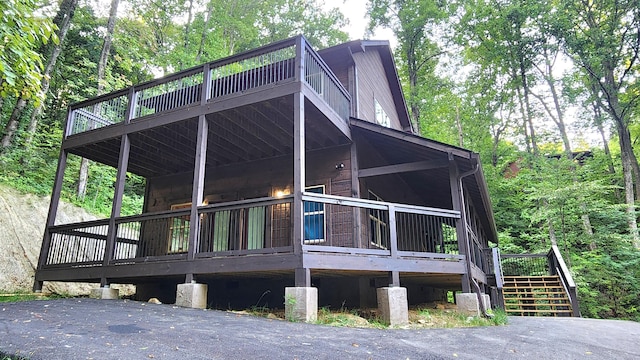 view of property exterior featuring a wooden deck