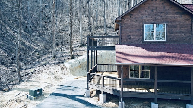 view of side of home with a wooden deck