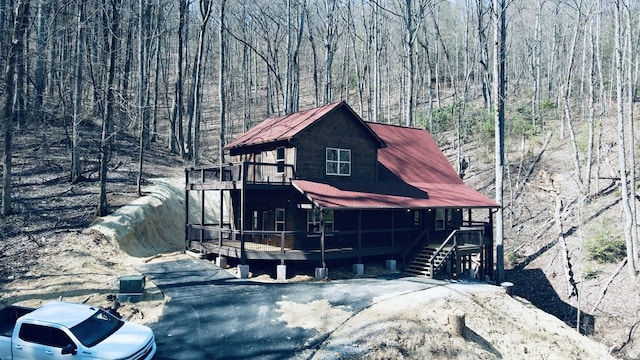 view of front facade with a wooden deck