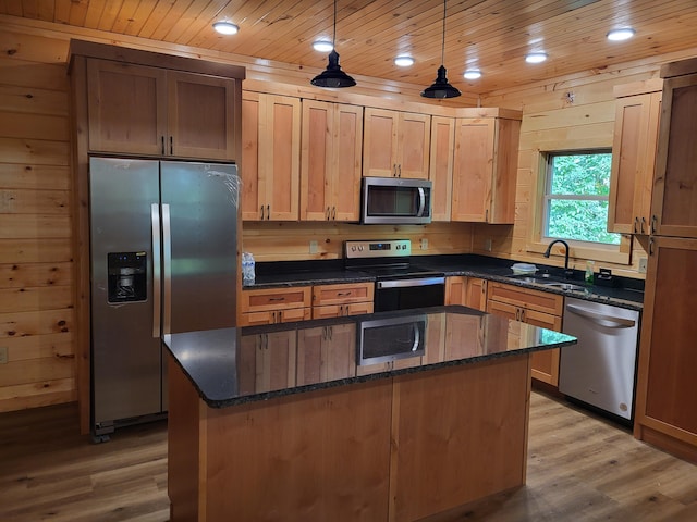 kitchen featuring pendant lighting, stainless steel appliances, a center island, and wooden ceiling