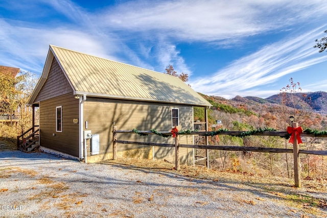 view of side of property with a mountain view