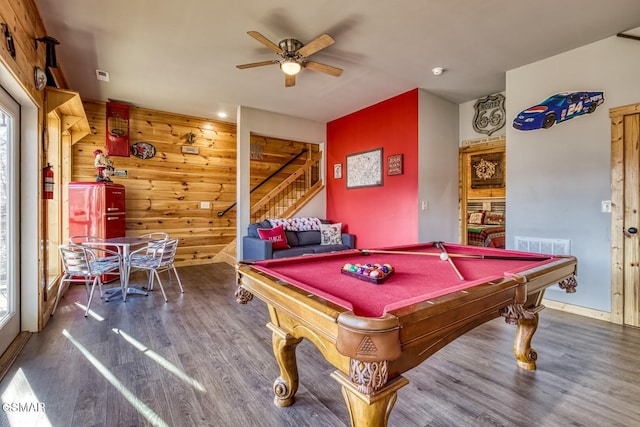 recreation room featuring pool table, ceiling fan, dark wood-type flooring, and wooden walls