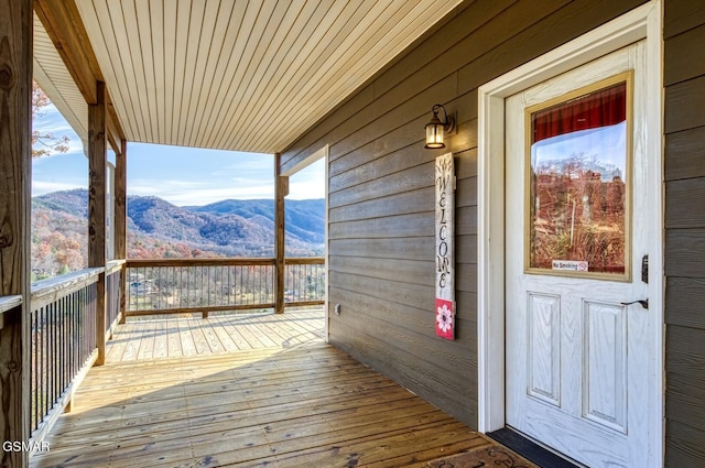 wooden terrace featuring a mountain view