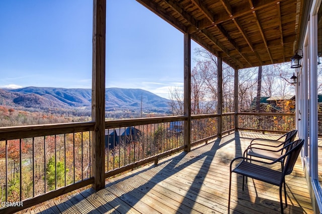 wooden terrace with a mountain view