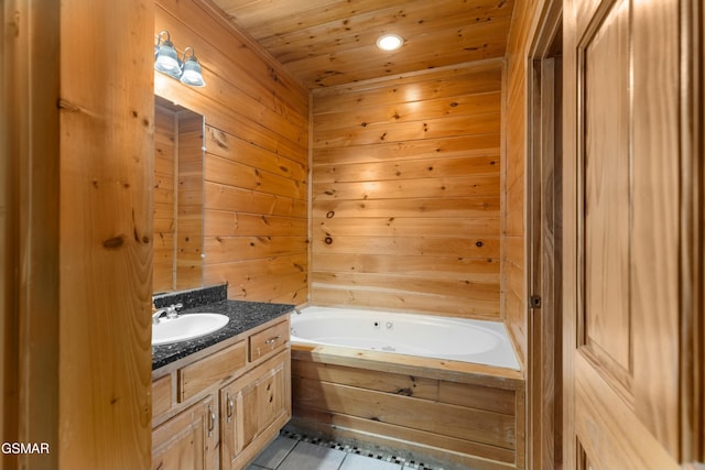 bathroom with a tub, vanity, tile patterned flooring, and wooden ceiling